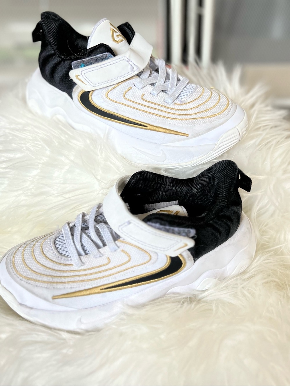 Nike Kids White and Black Sneakers with Gold Accents